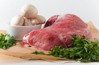 Fresh meat with mushrooms and parsley
