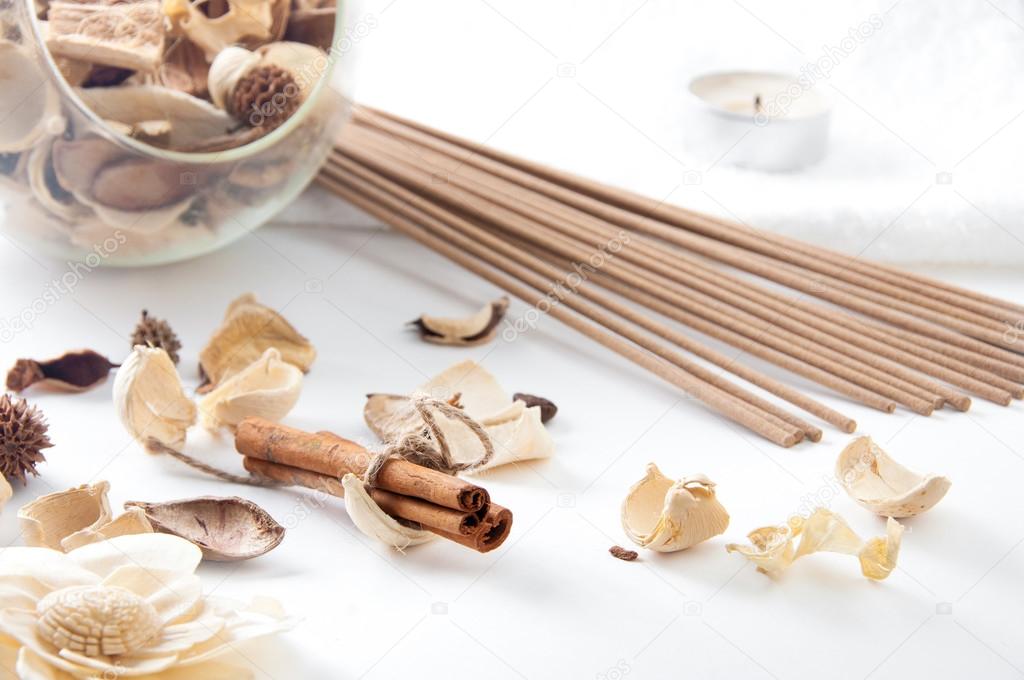 Spa still life with cinnamon, perfume sticks and floral potpourr