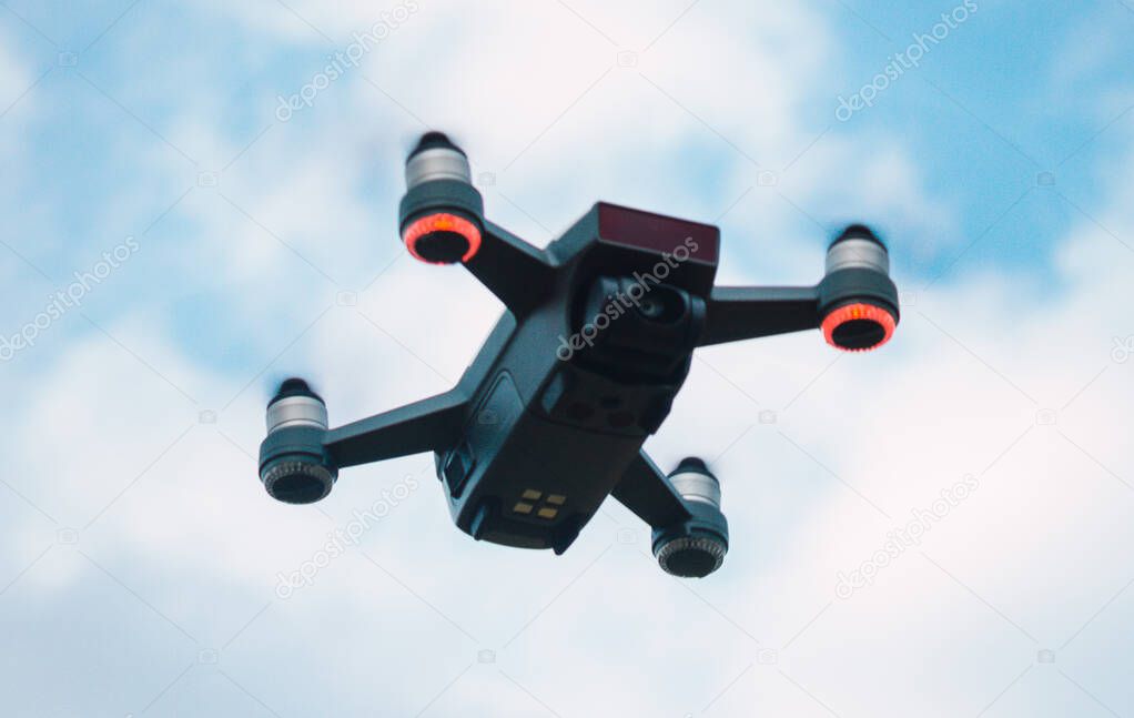 professional drone flying in the blue sky