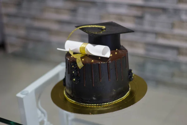 black college degree ceremony cake with blur background