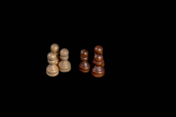 chess a good game for the brain and strategy. wooden chessborad. black vs white. conflict people