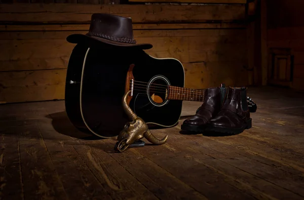 Guiatr for country music a hat and boots all you need to country dance.