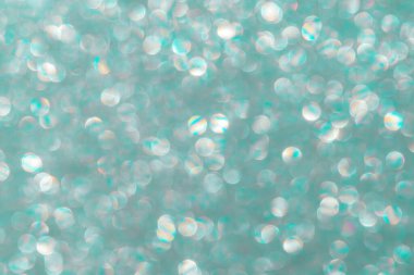 Odaklanmamış bokeh ile soyut parlak arkaplan. Gri-yeşil, 2021 'in moda rengi. Doğal sessiz gölgeler. Yılbaşı tatili ışıl ışıl arka plan. Bir kartpostalın ya da pankartın düzeni