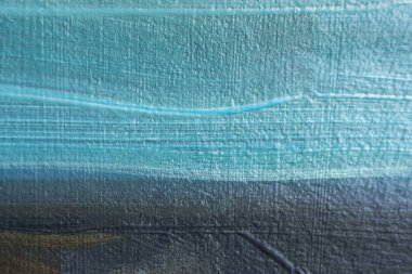 Çadır bezinde yağlı boya olan çok renkli bir arkaplan. Soyut sanat geçmişi. Pankart için yaratıcı bir arka plan. Yakın plan lekeleri. Arka plan dizaynı mavi, gri, kahverengi. Yağlı boya resim sanatı..