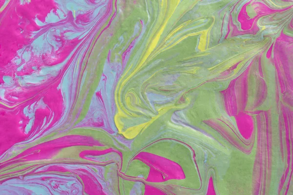 Abstract fluid art texture. A multicolored pictorial fragment of a painting. Bright acrylic drawing of pink, yellow, purple, pale green and blue shades close-up. The concept of summer mood, flowering