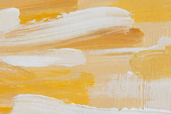 Yellow and white acrylic oil painting abstract background. A fragment of a painting on canvas. Colored beige pastel texture. Modern art, active brush strokes. Summer art background in warm sand shades