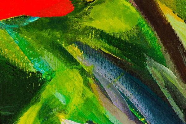 Multi-colored oil painting. Abstract artistic bright background. A fragment of a picture on cardboard. Spring flowers painting. The texture of paint strokes in close-up. Mixing contrast of green red