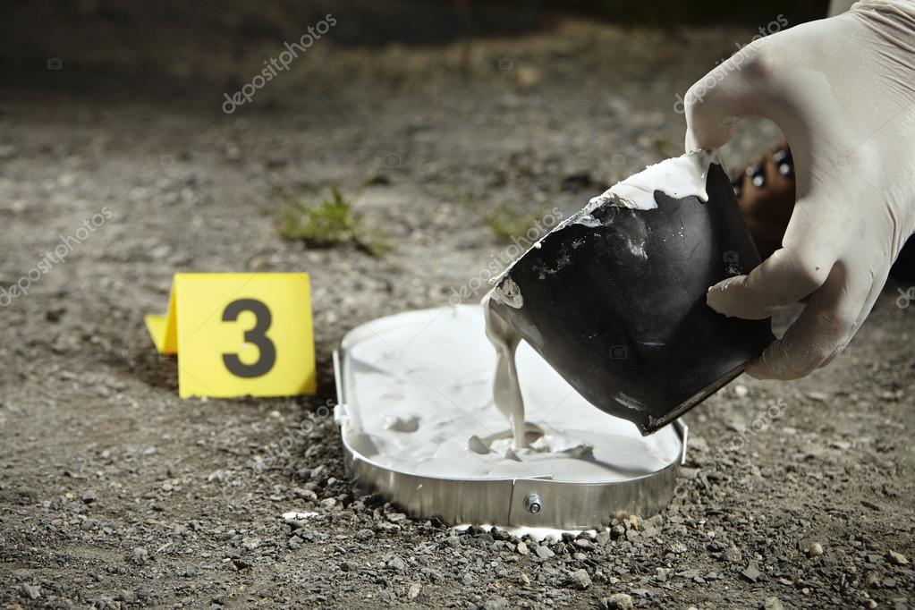 Casting of footprint on crime scene — Stock Photo © Couperfield 113066886