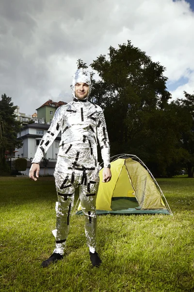 Man in park wrapped to aluminium foil for eavesdropping — Stock Photo, Image