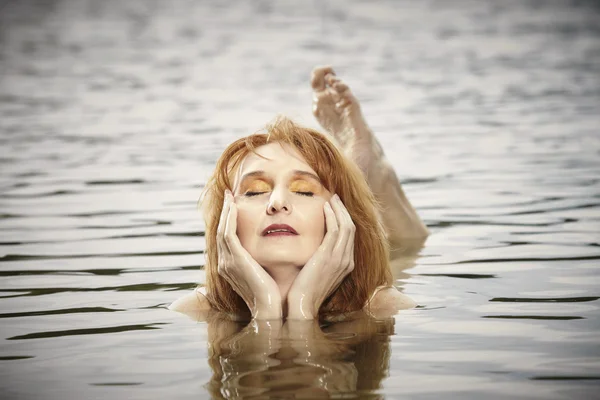 Red hair nice lady portrait in water — Stock Photo, Image