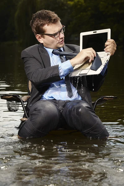 Wet manager cleaning wet notebook — Stock Photo, Image