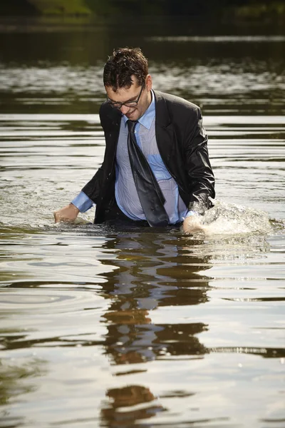 Manager swimming in suit — Stock Photo, Image