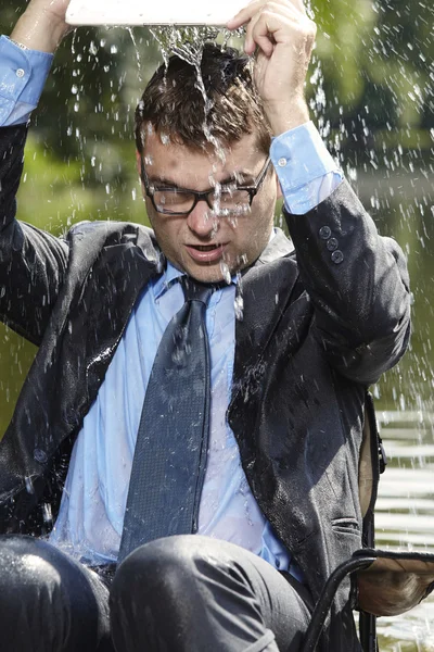 Water pouring out of notebook — Stock Photo, Image