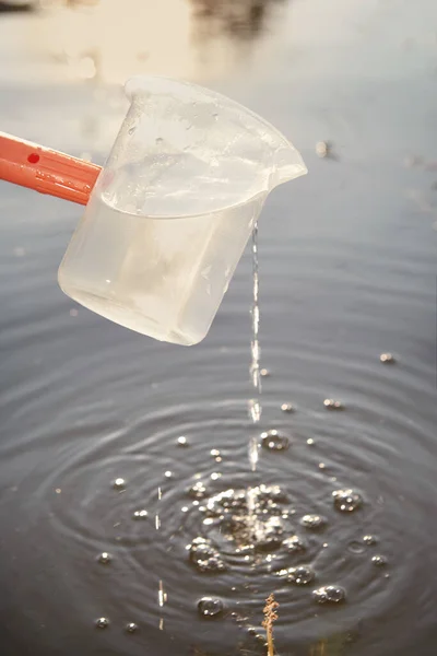 Detail of sampling beaker used for water samples collecting