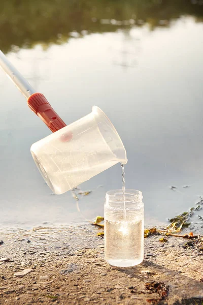 Detail of sampling beaker used for water samples collecting