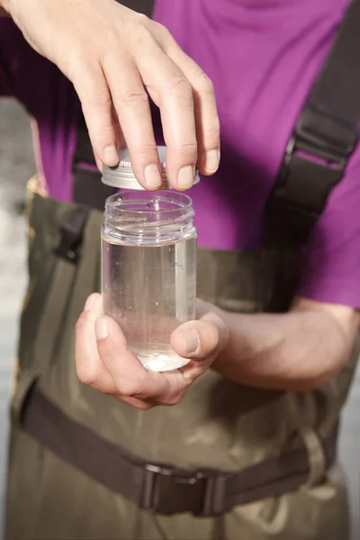 Water Quality Analyst Dressed Chest Wader Closing Bottle Water Sample — Fotografia de Stock