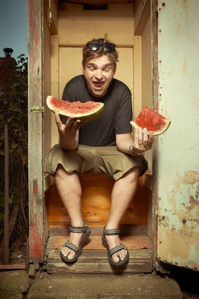 Man Sitting Wooden Toilet Latrine Eating Watermelon — Stock Photo, Image