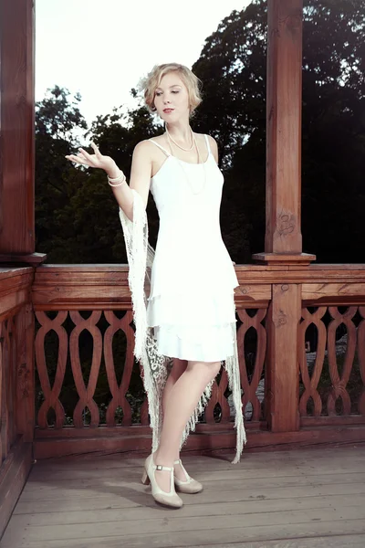 Young woman in summer house in park — Stock Photo, Image