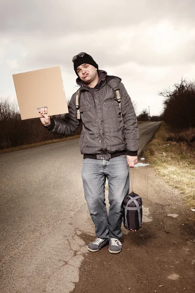 Ugly hitch-hiker — Stock Photo, Image