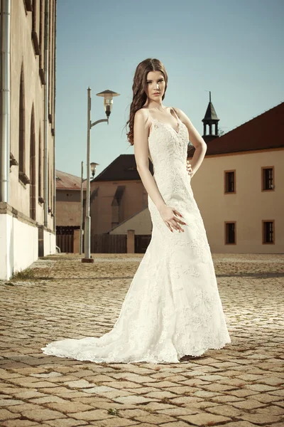 Pretty lady in white wedding apparel — Stock Photo, Image