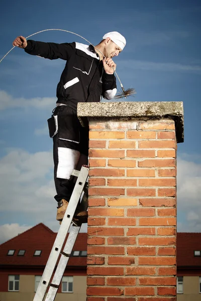 Chimney sweep man doing his job — Stock Photo, Image