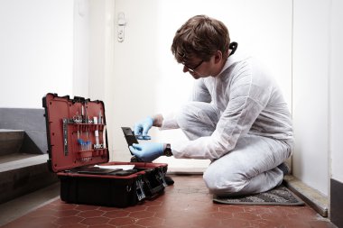 Technician criminologist and his suitcase
