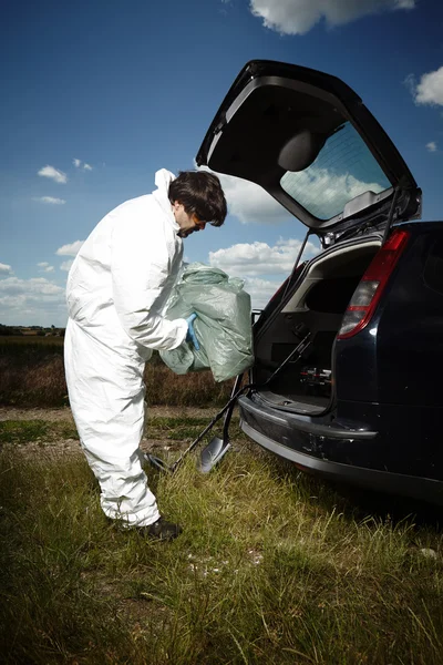 Criminologist technician after pickup of evidence — Stock Photo, Image