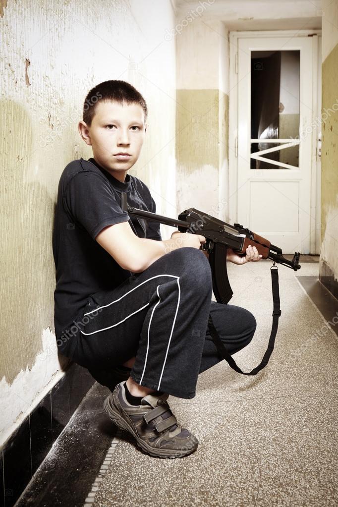 Teenager with Kalashnikov