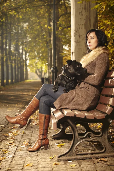 Nice lady and her dog in park — Stock Photo, Image