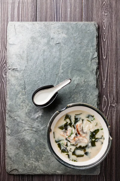 Creamy soup with Eel and spoon — Stock Image Creamy soup with Eel and spoon Royalty Free Stock Photos