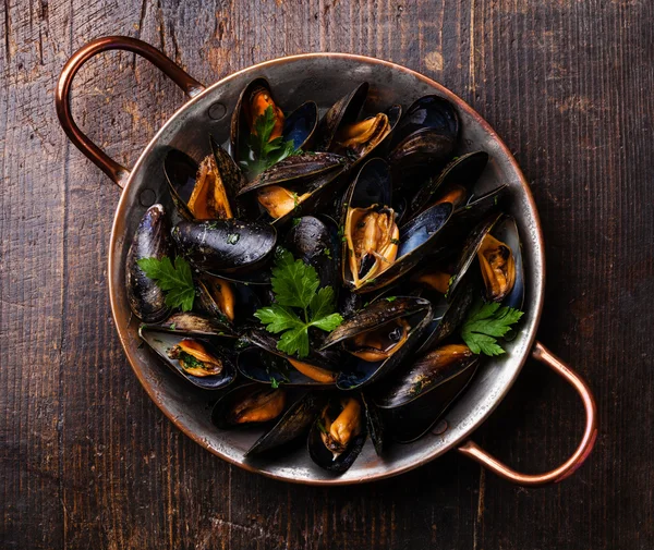 Mussels in copper cooking dish