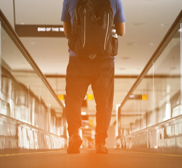 Pedestrian walking with zooming motion blur — Stock Photo, Image