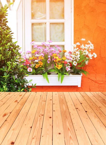 Flower box in window of orange building