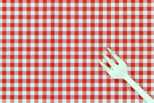 Top View Plastic Fork Checkered Tablecloth — Stock Photo, Image