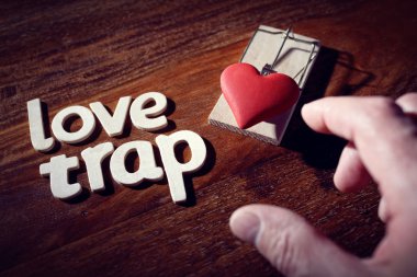 Mousetrap with heart concept clipart