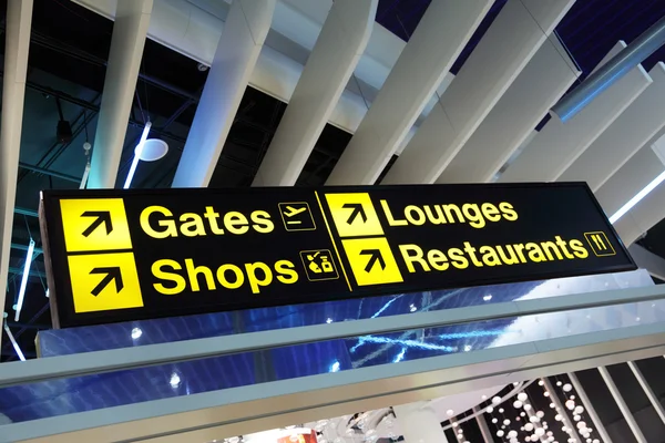 Airport terminal direction sign — Stock Photo, Image