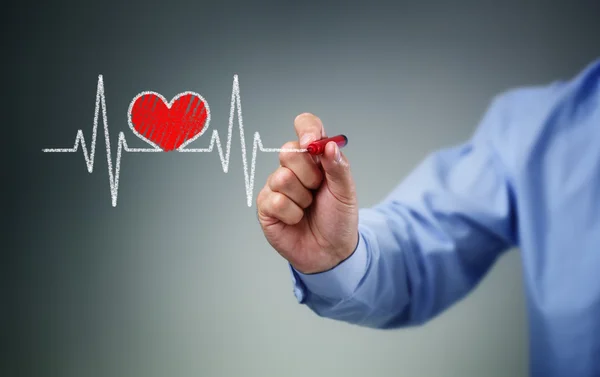 Biznesmen ręcznie rysunek wykres bicia serca — Zdjęcie stockowe