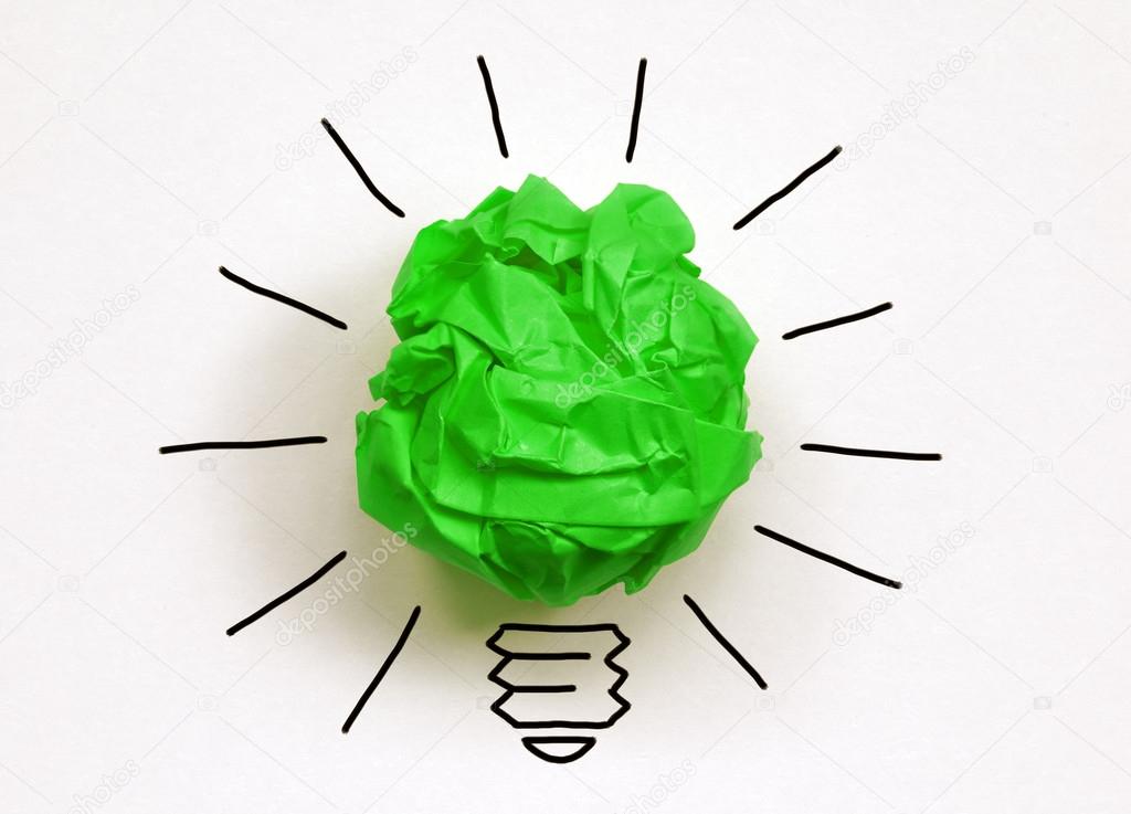 Crumpled green paper light bulb metaphor