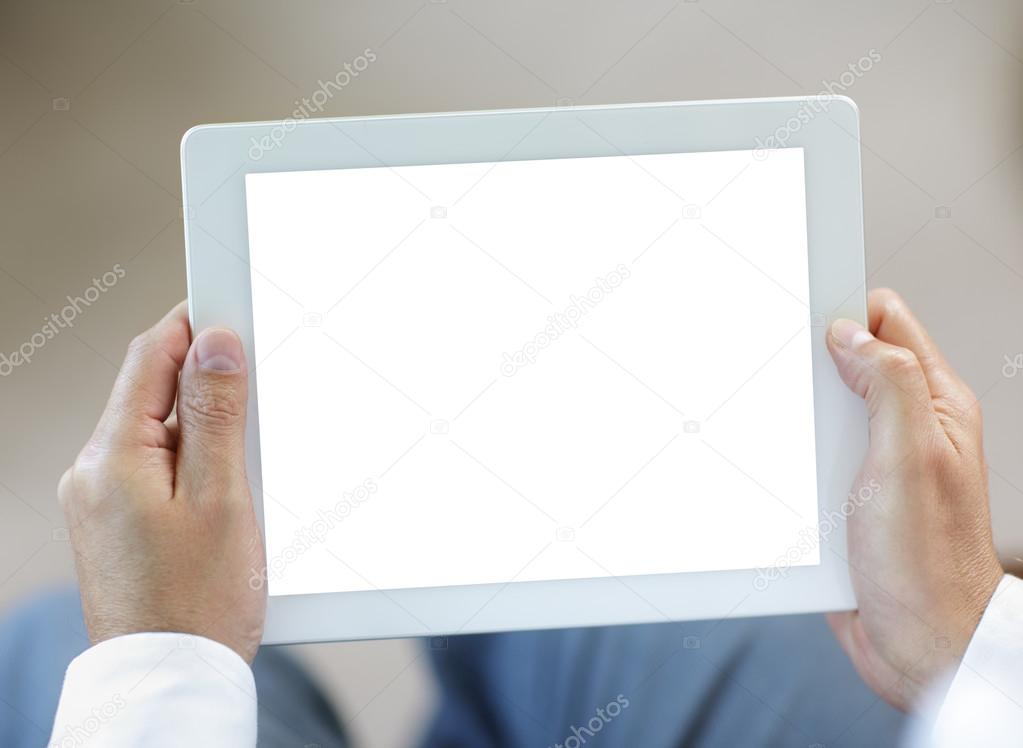 Digital tablet held by businessman