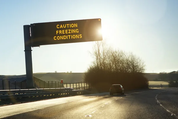 Motorway gantry sign in winter — Stock Photo, Image