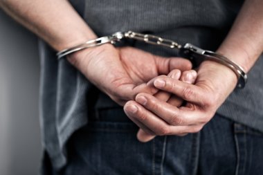 Arrested man in handcuffs clipart