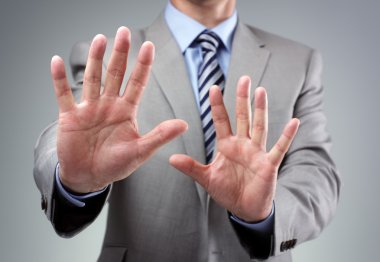 Stop or fear gesture from businessman clipart