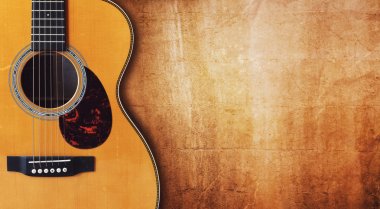Acoustic guitar against  grunge background clipart