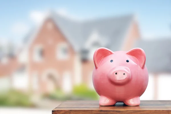 Piggy bank with property — Stock Photo, Image