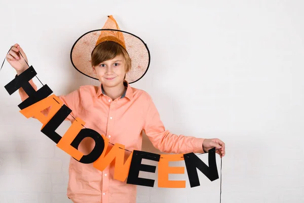 Blond Boy Orange Hat Hangs Inscription Halloween Decorates His Room — Stock Photo, Image