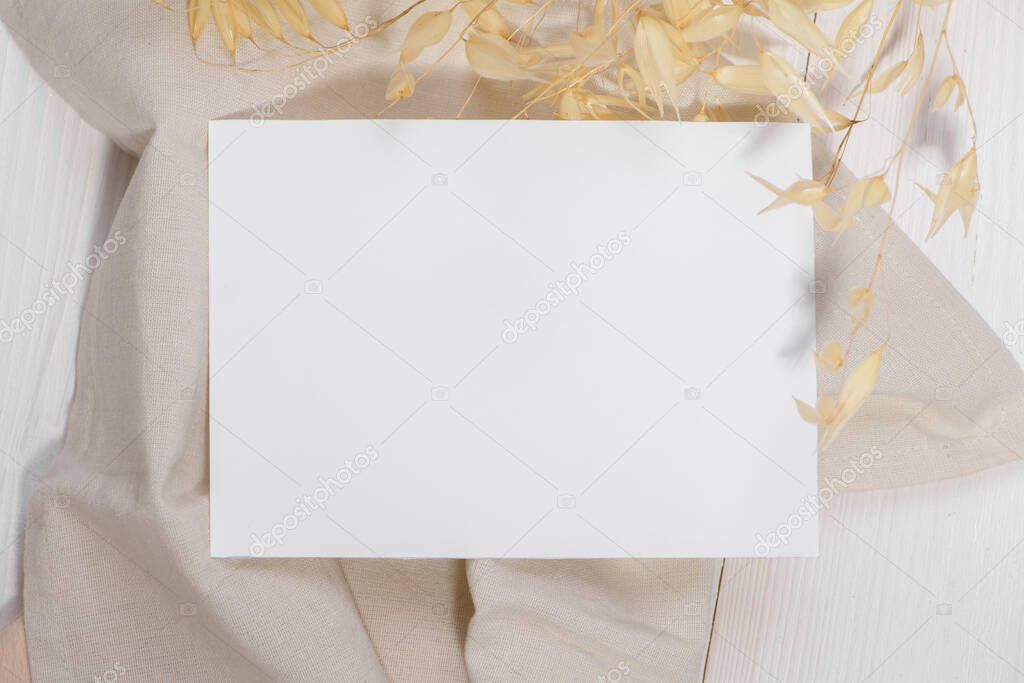 Card mockup template, empty stationery card with dry plants flower and natural linen on a white background and design element for wedding invitation, rsvp, thank you card, greeting