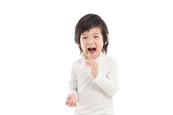 Cute asian child eating japanese dessert — Stock Photo, Image