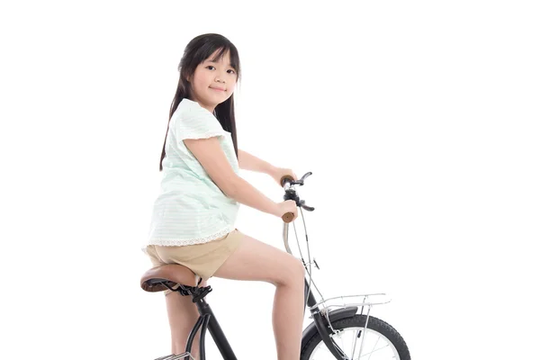 Chica asiática montando una bicicleta — Foto de Stock