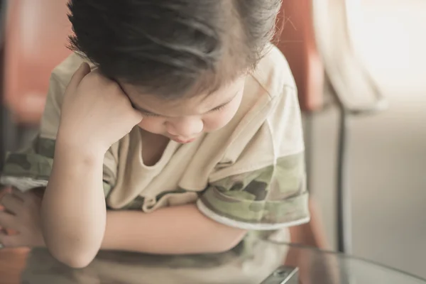 Asian child thinking Stock Photo