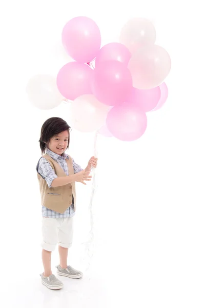 Asiatiska barn innehar rosa och vita ballonger — Stockfoto